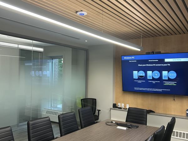 Linear pendant light over a boardroom table
